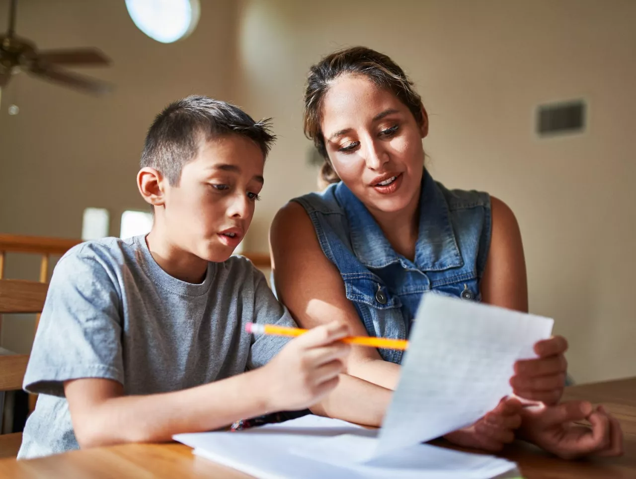 Photo: A mother and son completing some homework